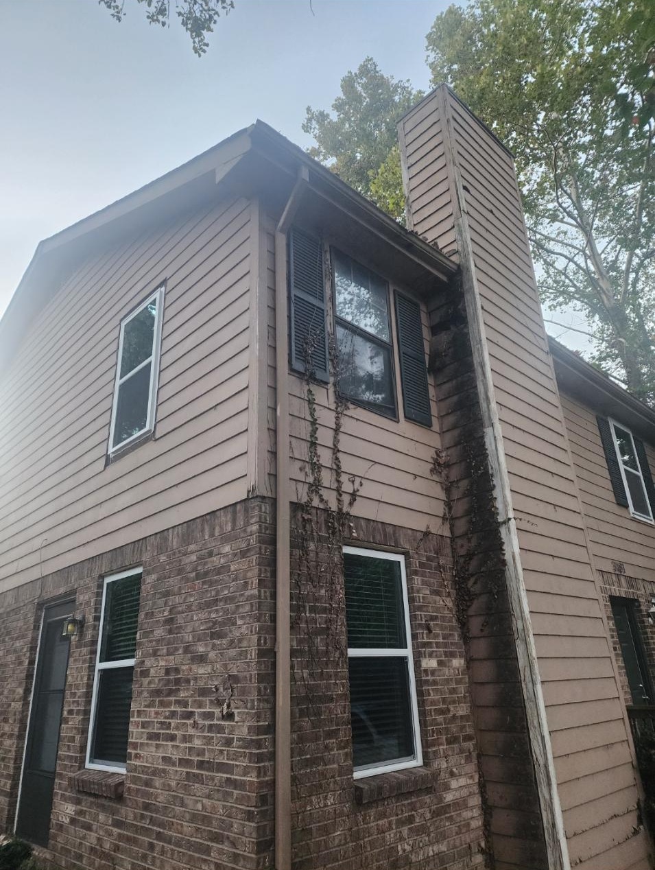 Finished replacement windows on a two-story home